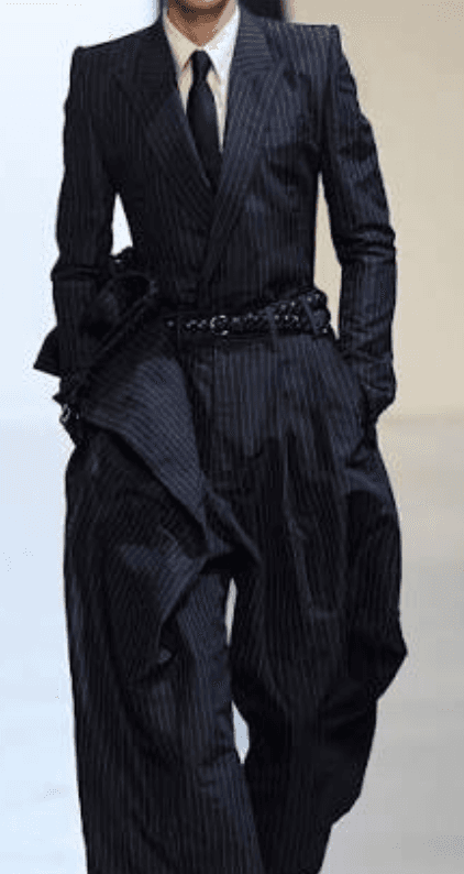 Oversized navy pinstripe suit with braided belt